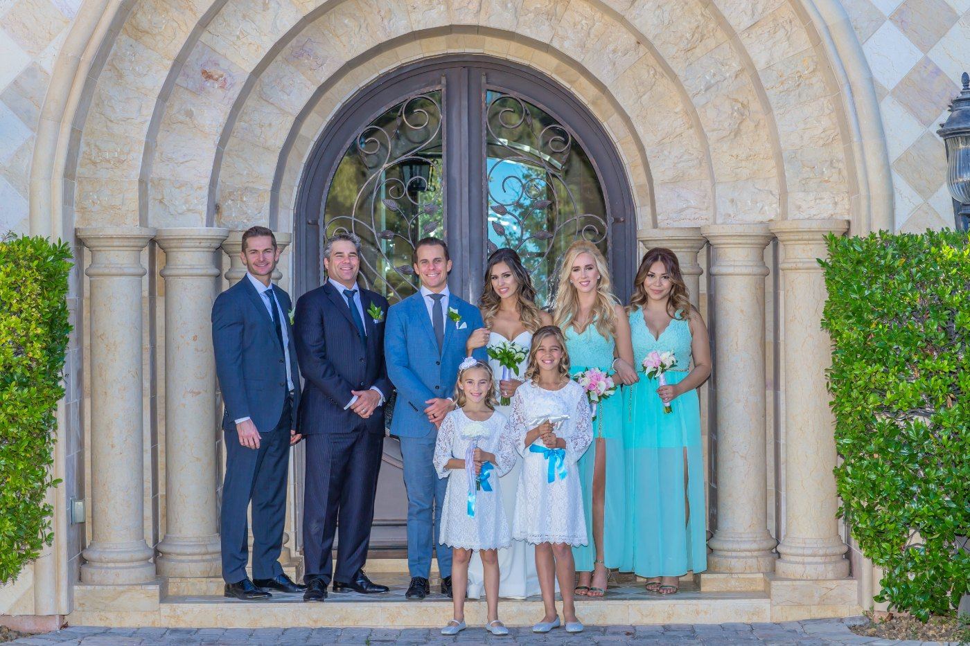 Las Vegas wedding photography — a family portrait at the arched chapel door
