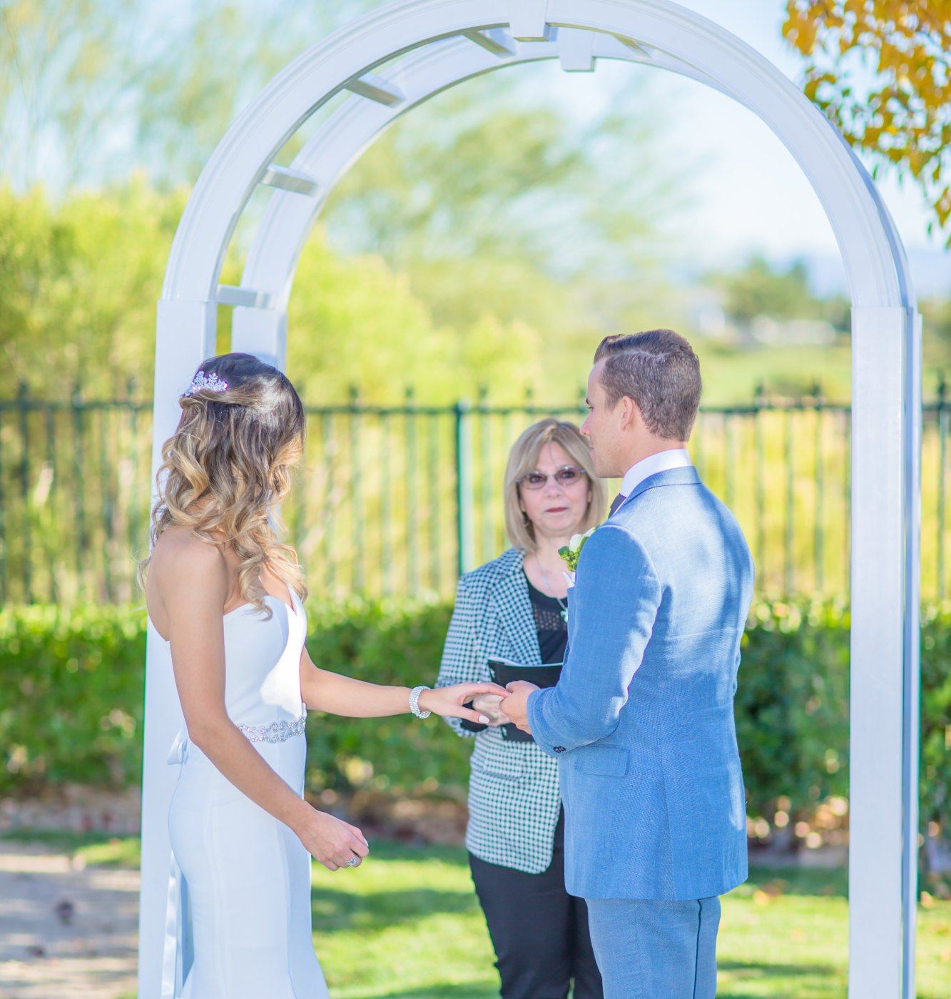 Las Vegas wedding photography — the ring exchange during the garden ceremony