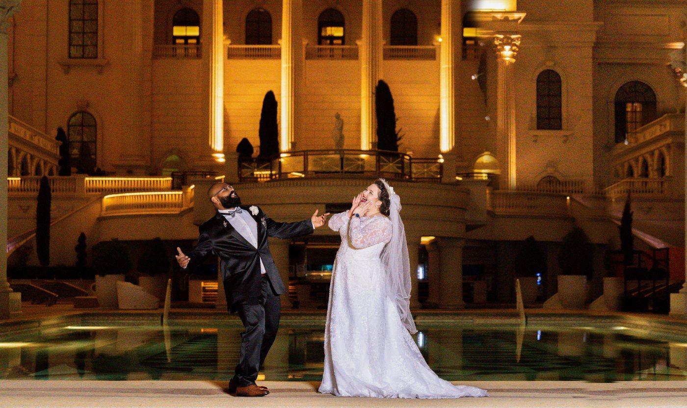 Las Vegas wedding photography — a playful pose beside the Caesars pool