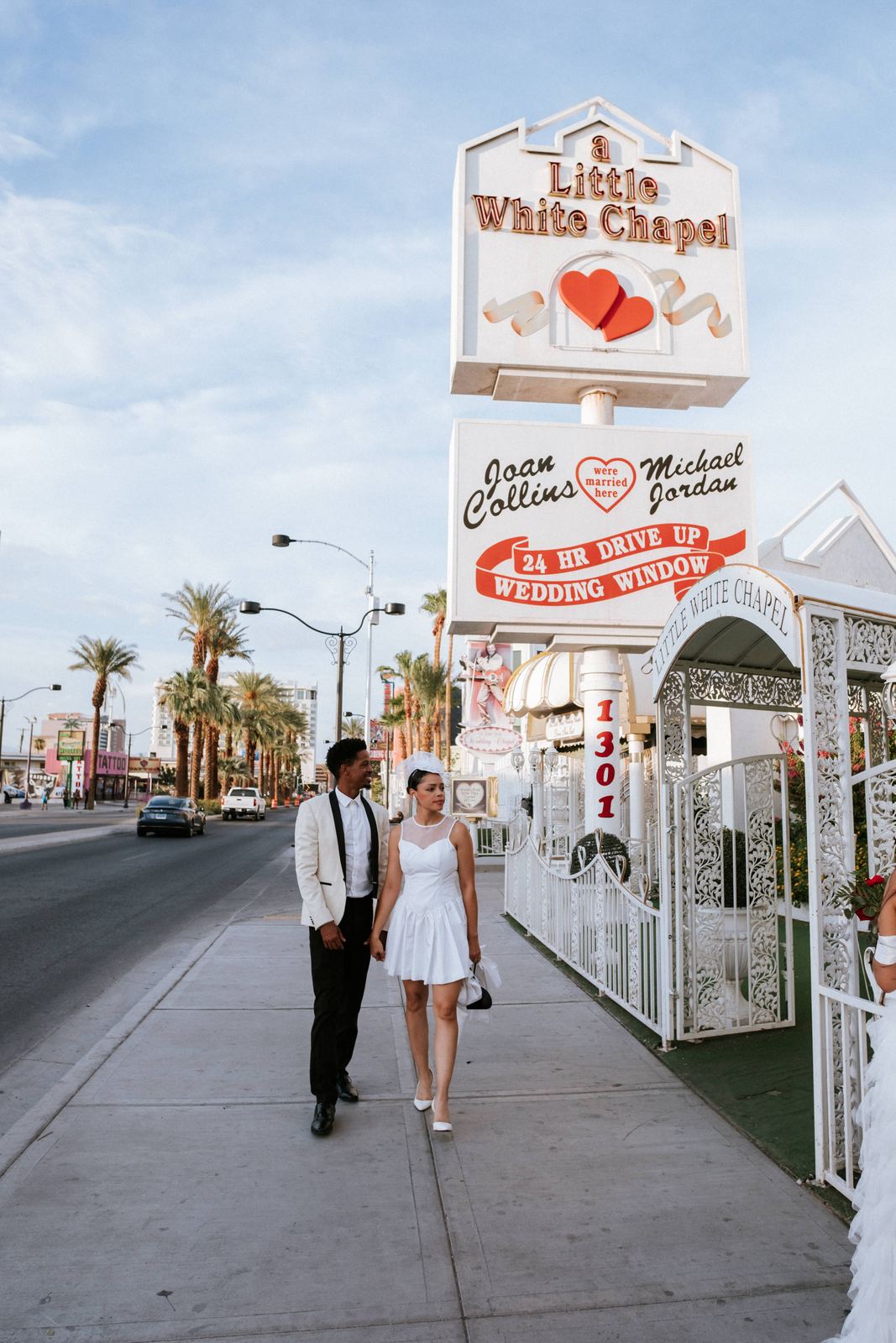 Las Vegas wedding photography — the couple approaching the Little White Wedding Chapel