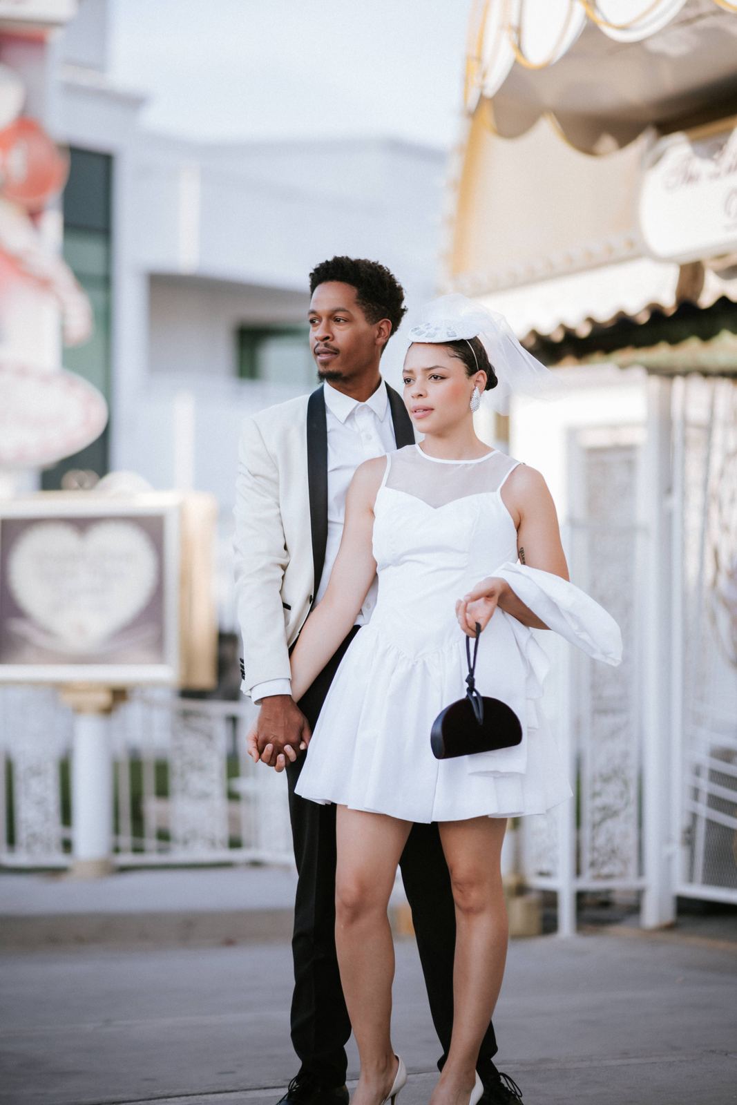 Las Vegas wedding photography — arm in arm past the chapel gate