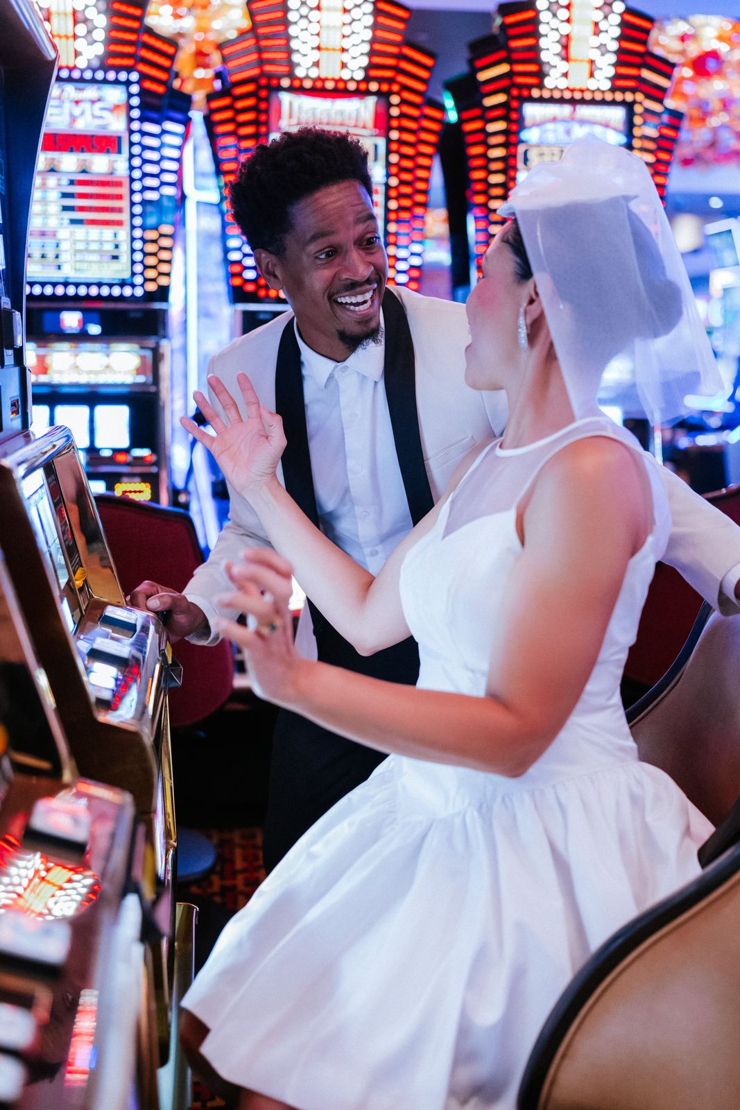 Las Vegas wedding photography — dancing together among the casino slot machines