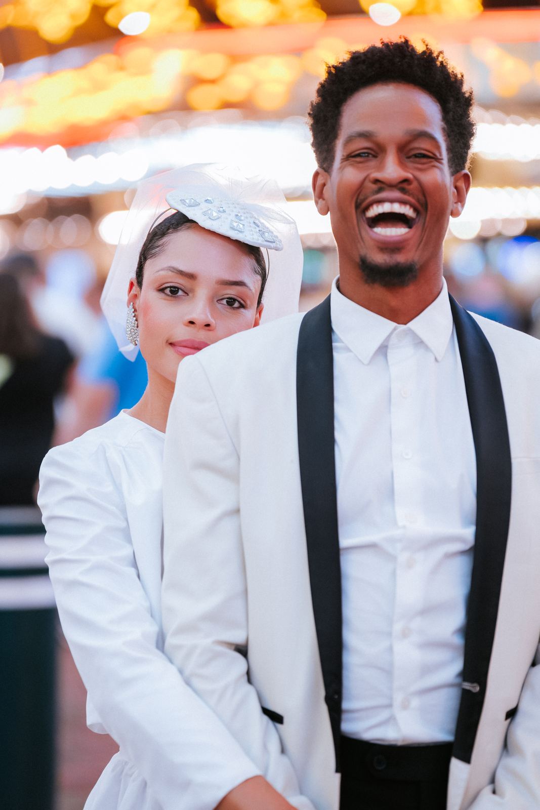 Las Vegas wedding photography — laughing together under the neon signs