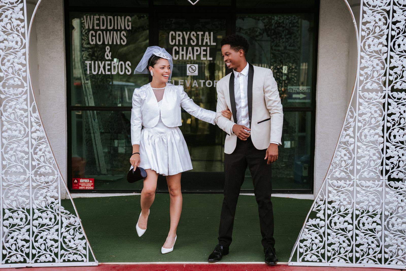 Las Vegas wedding photography — a joyful exit from the Wedding Gowns & Tuxedos shop