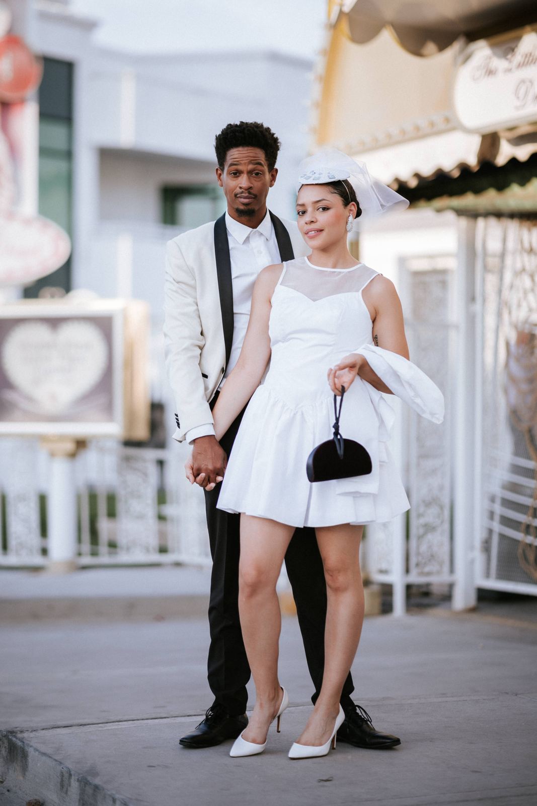 Las Vegas wedding photography — standing together under a heart-shaped awning