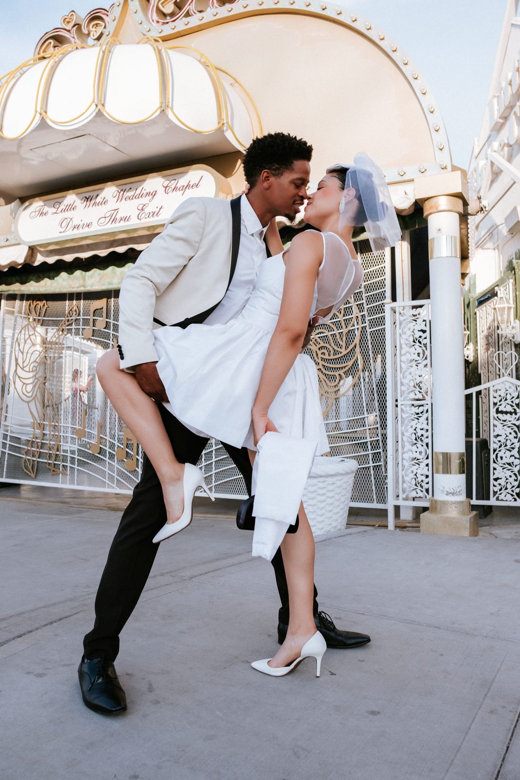 Las Vegas wedding photography — the groom lifting his bride in celebration