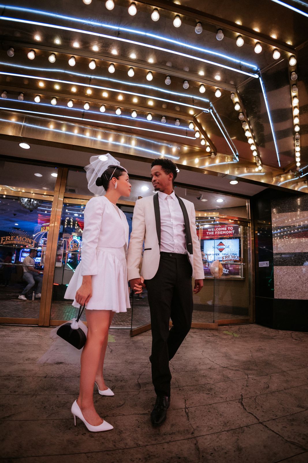 Las Vegas wedding photography — walking beneath the Fremont Street Experience canopy