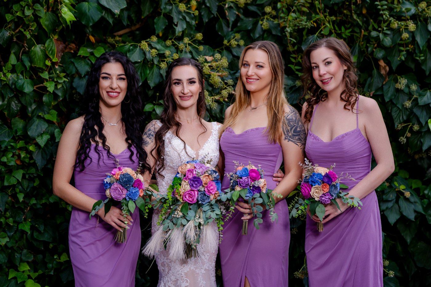 Las Vegas wedding photography — bridesmaids in purple holding jewel-toned bouquets