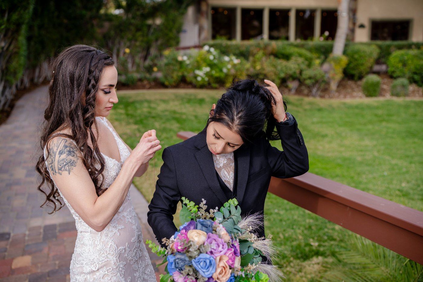 Las Vegas wedding photography — the two brides laughing during their first look