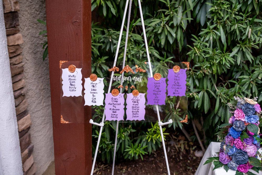 Las Vegas wedding photography — a purple wax-sealed seating chart on an acrylic stand