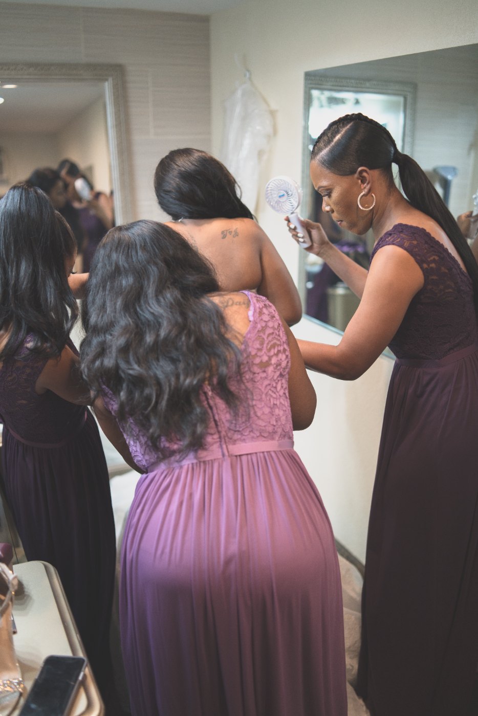 Las Vegas wedding photography — bridesmaids helping each other get ready