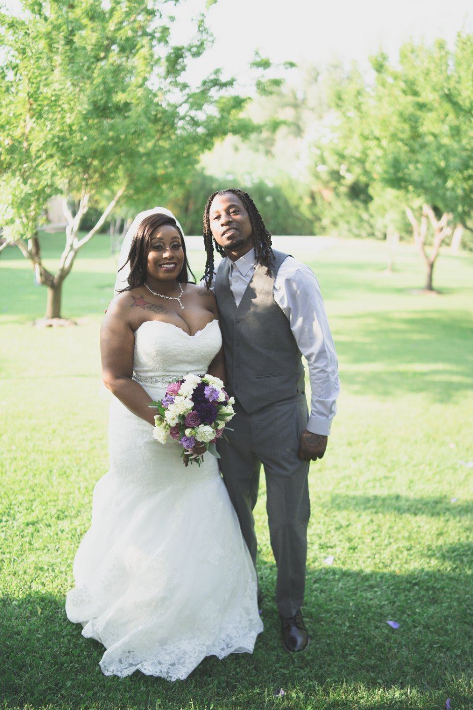 Las Vegas wedding photography — the couple together in the garden with her bouquet