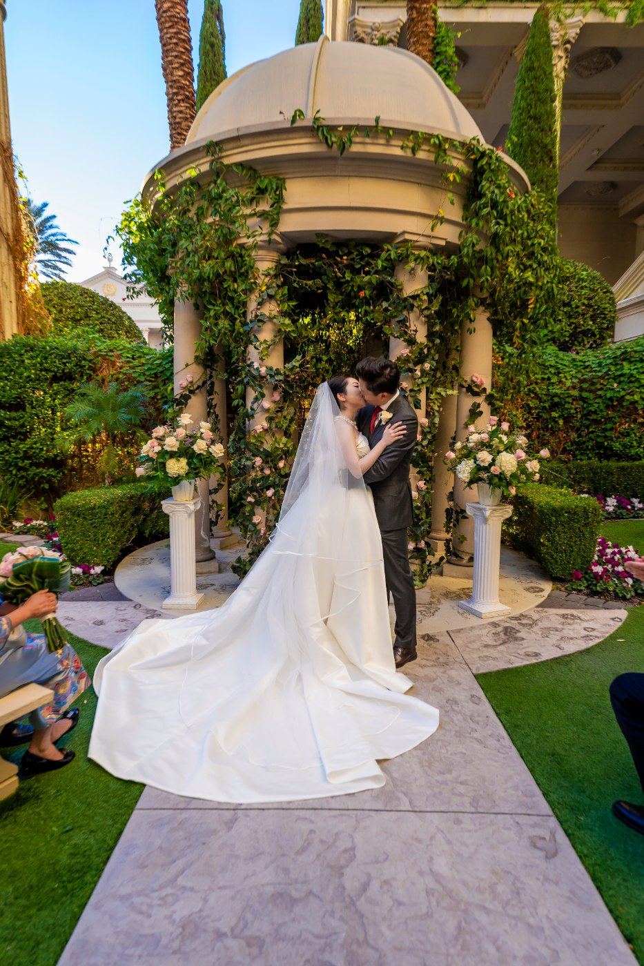 Las Vegas wedding photography — the bride at the gazebo with her train laid out behind her
