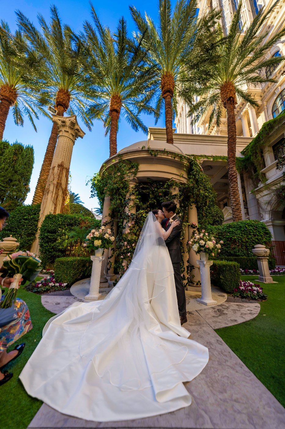 Las Vegas wedding photography — the bride’s train fanned out across the gazebo steps