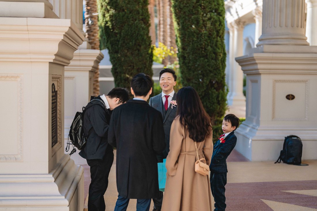 Las Vegas wedding photography — family gathering among the columns before the ceremony
