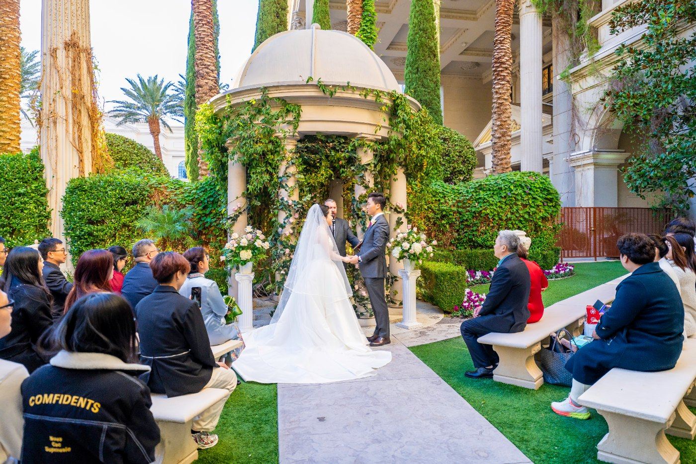 Las Vegas wedding photography — the garden ceremony with guests seated around the gazebo