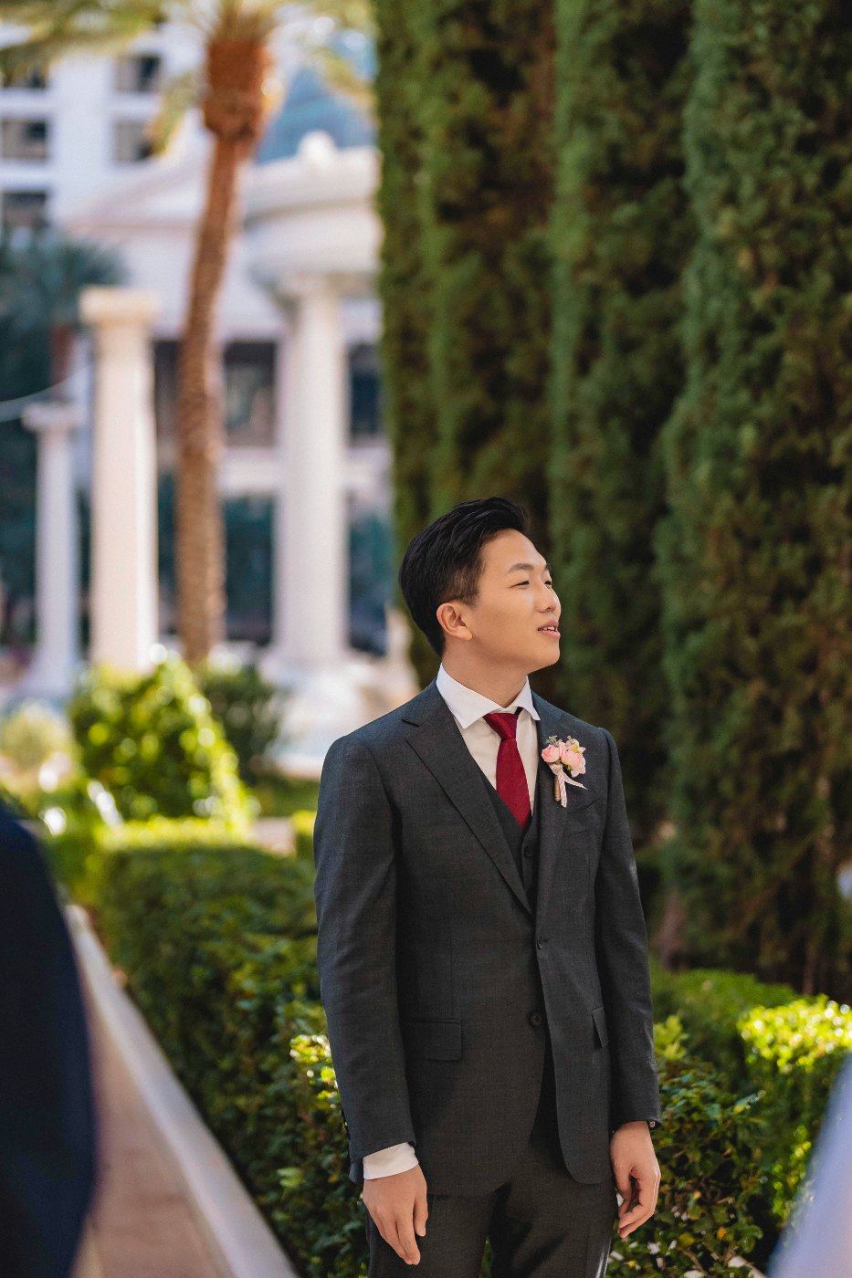 Las Vegas wedding photography — the groom waiting alone in the garden before the ceremony